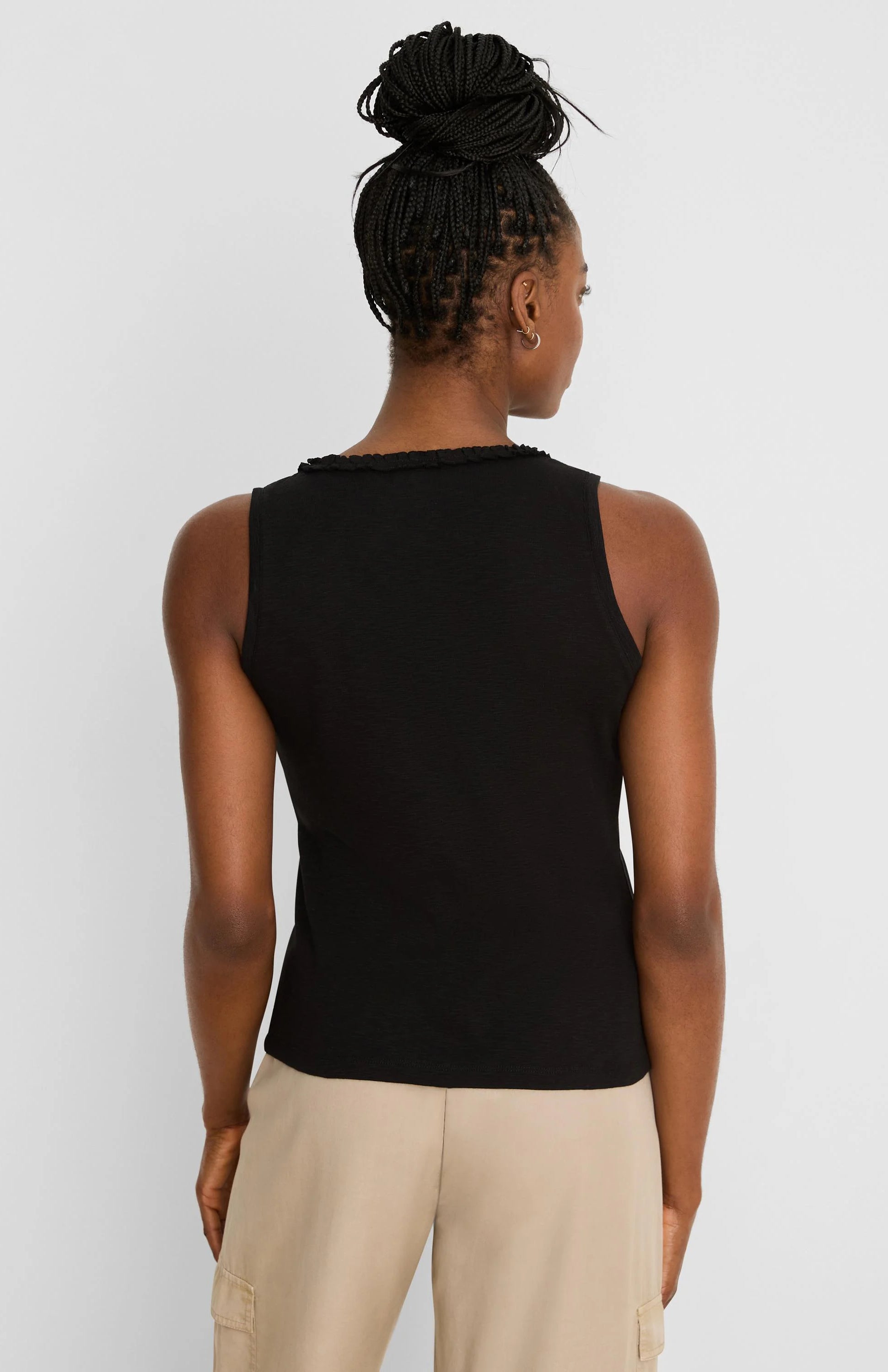 Black cotton slub ruffle neck tank top, viewed from the back on a model.