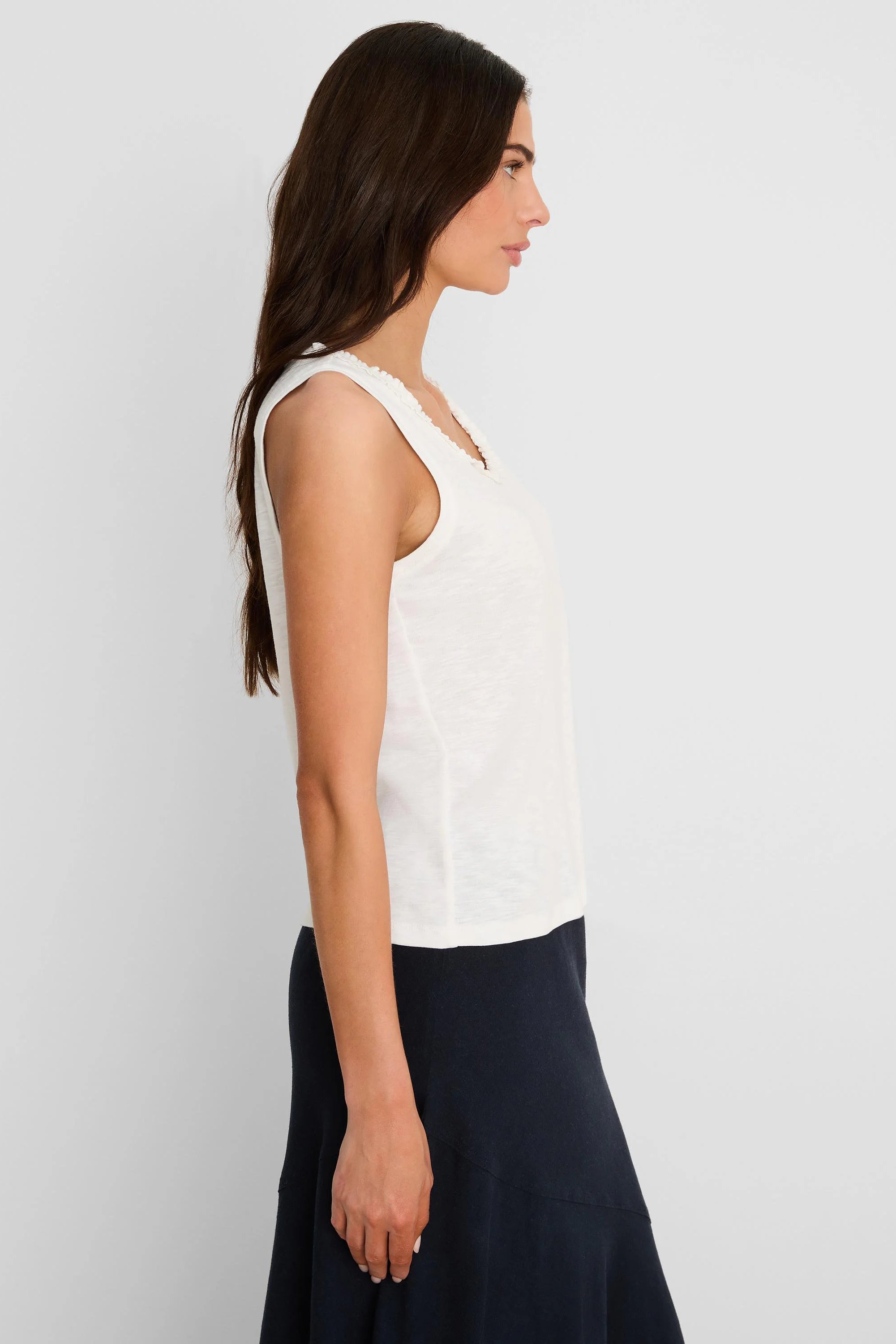 Off-white cotton slub tank top with a ruffle neck.