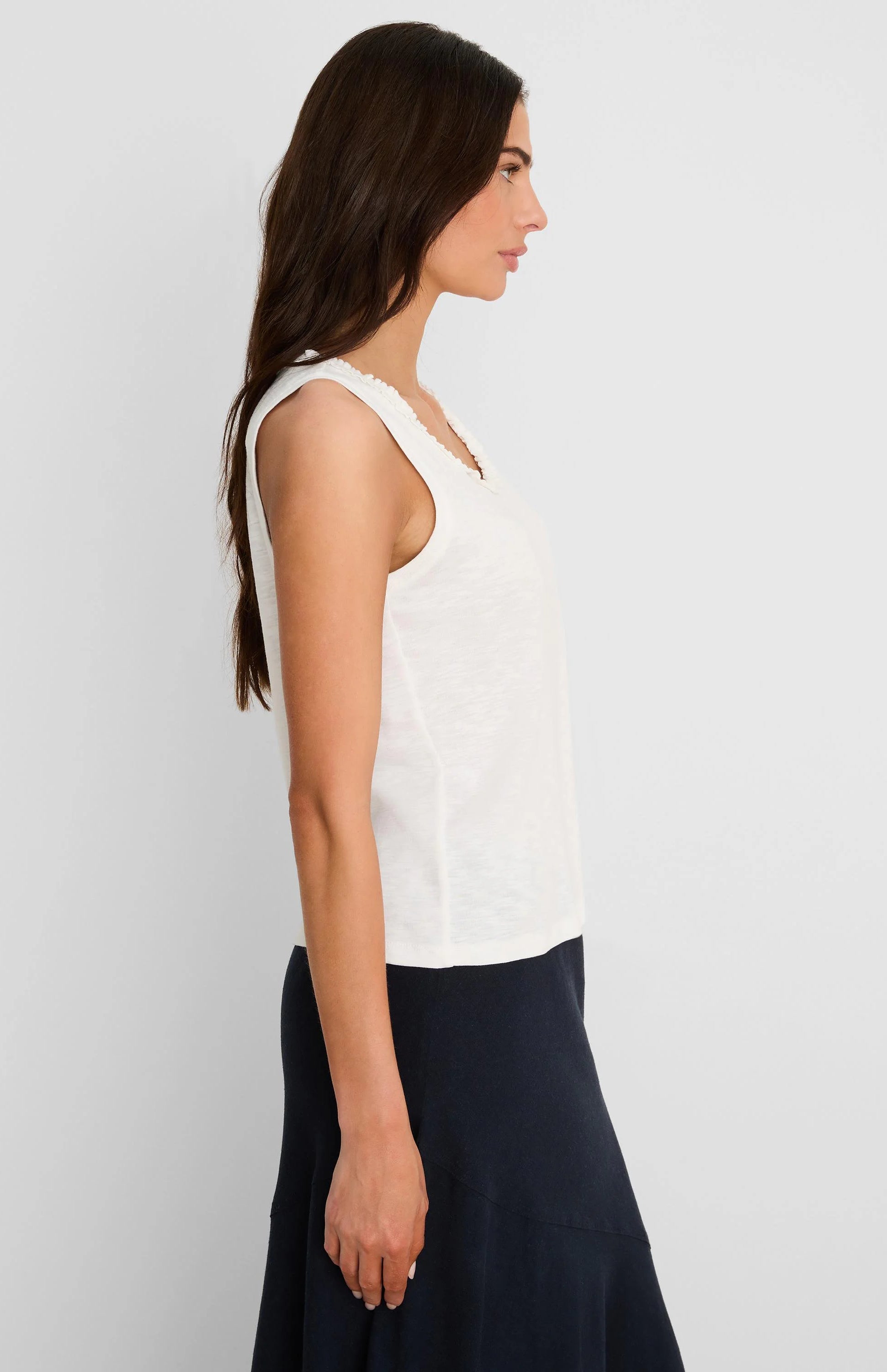 Off-white cotton slub tank top with a ruffle neck.