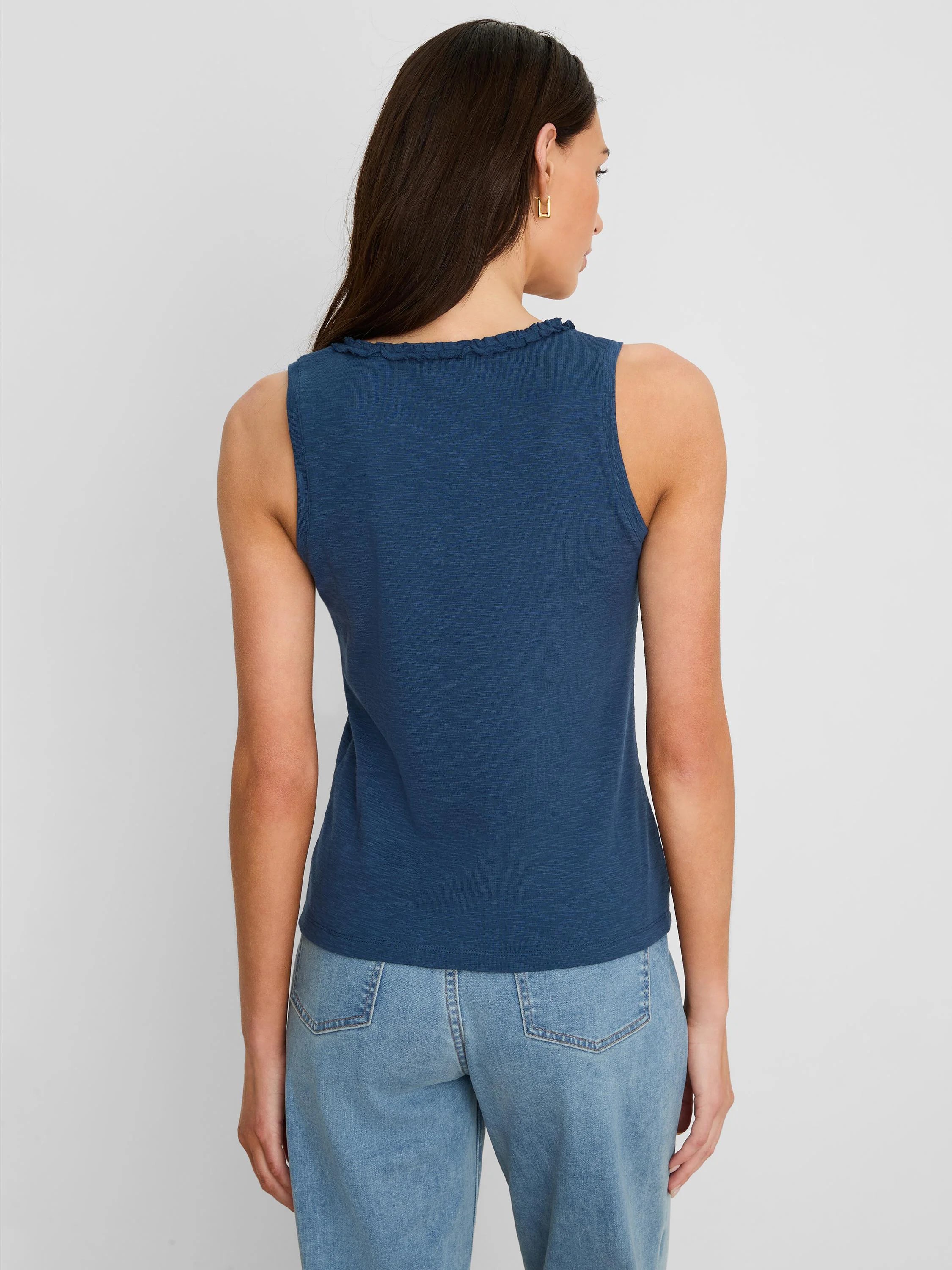 Back of a slate blue cotton slub tank top with ruffled neckline.