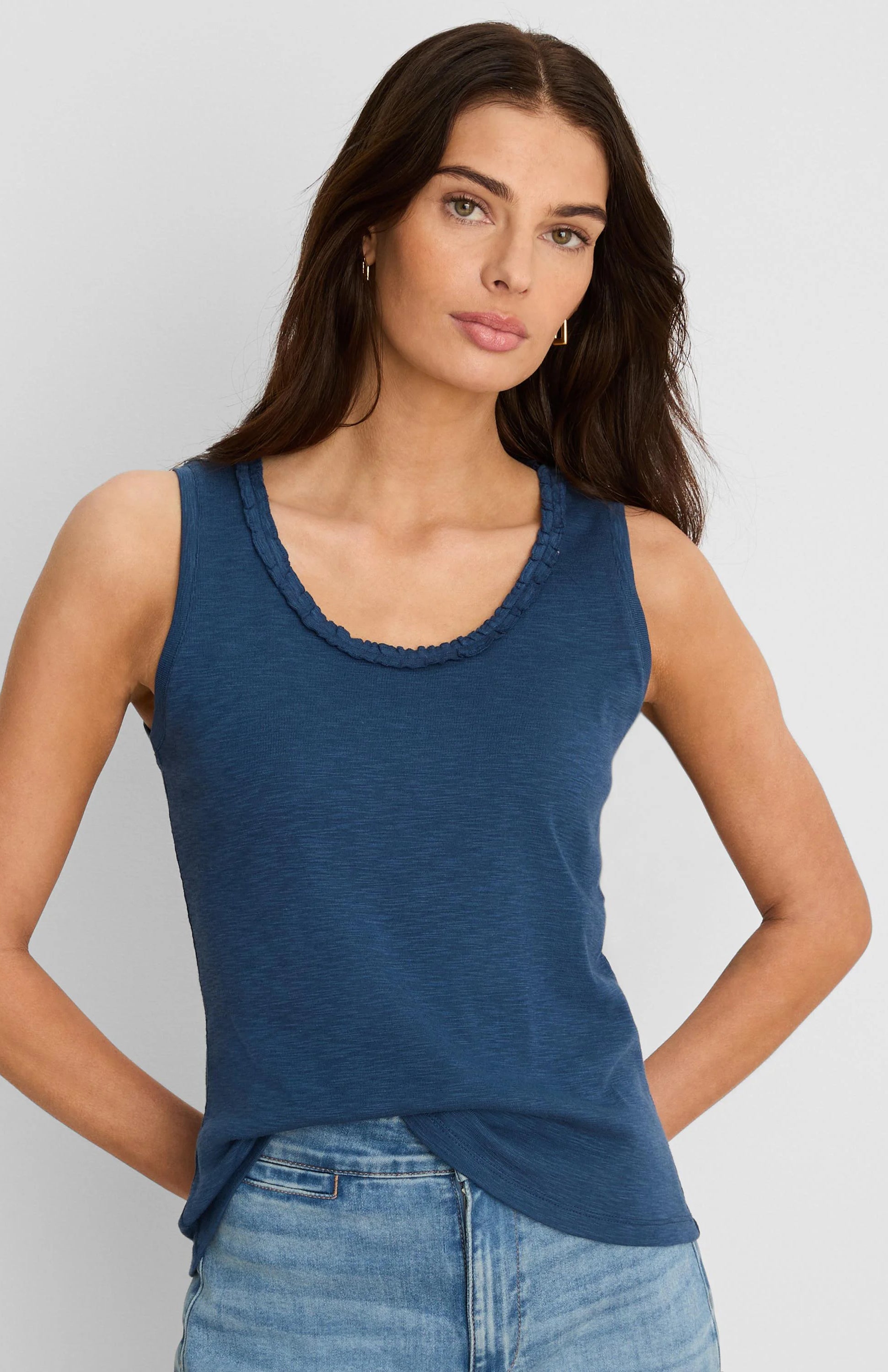Indigo blue cotton slub tank top with a ruffled scoop neck.