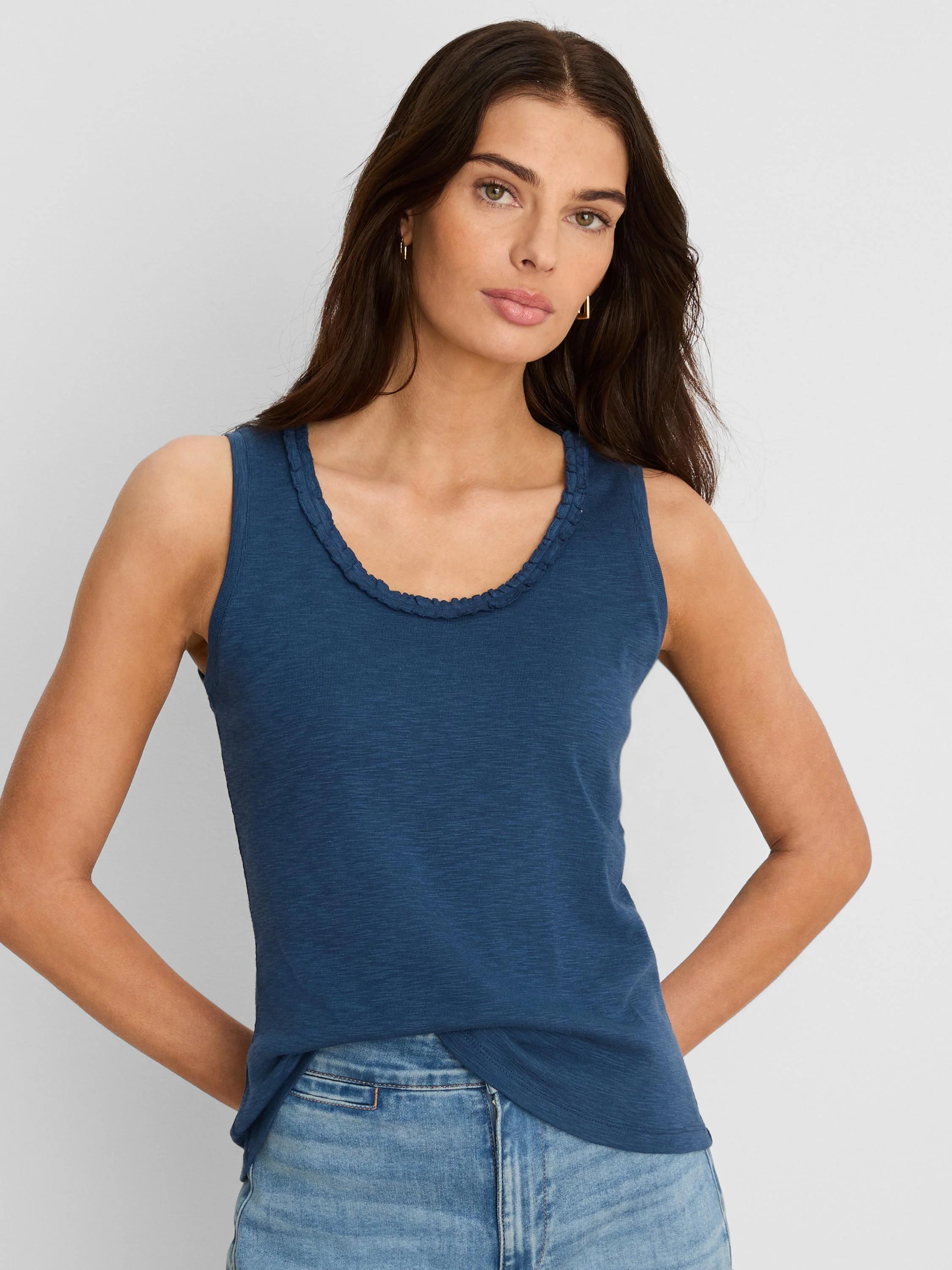 Indigo blue cotton slub tank top with a ruffled scoop neck.