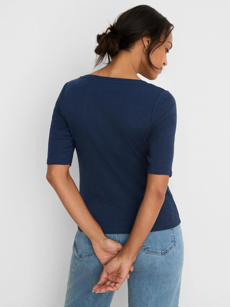 Navy blue elbow-sleeve tee, shown from the back on a model. Features a subtle textured fabric.