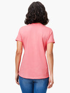 Faded coral short sleeve crew neck tee on a model's back, featuring a shirt tail hem.