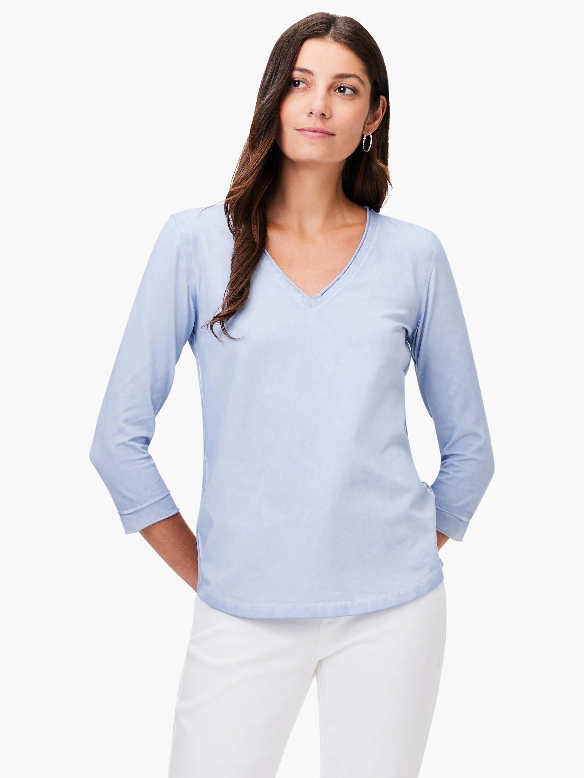 Light blue V-neck tee with 3/4 length rolled sleeves.