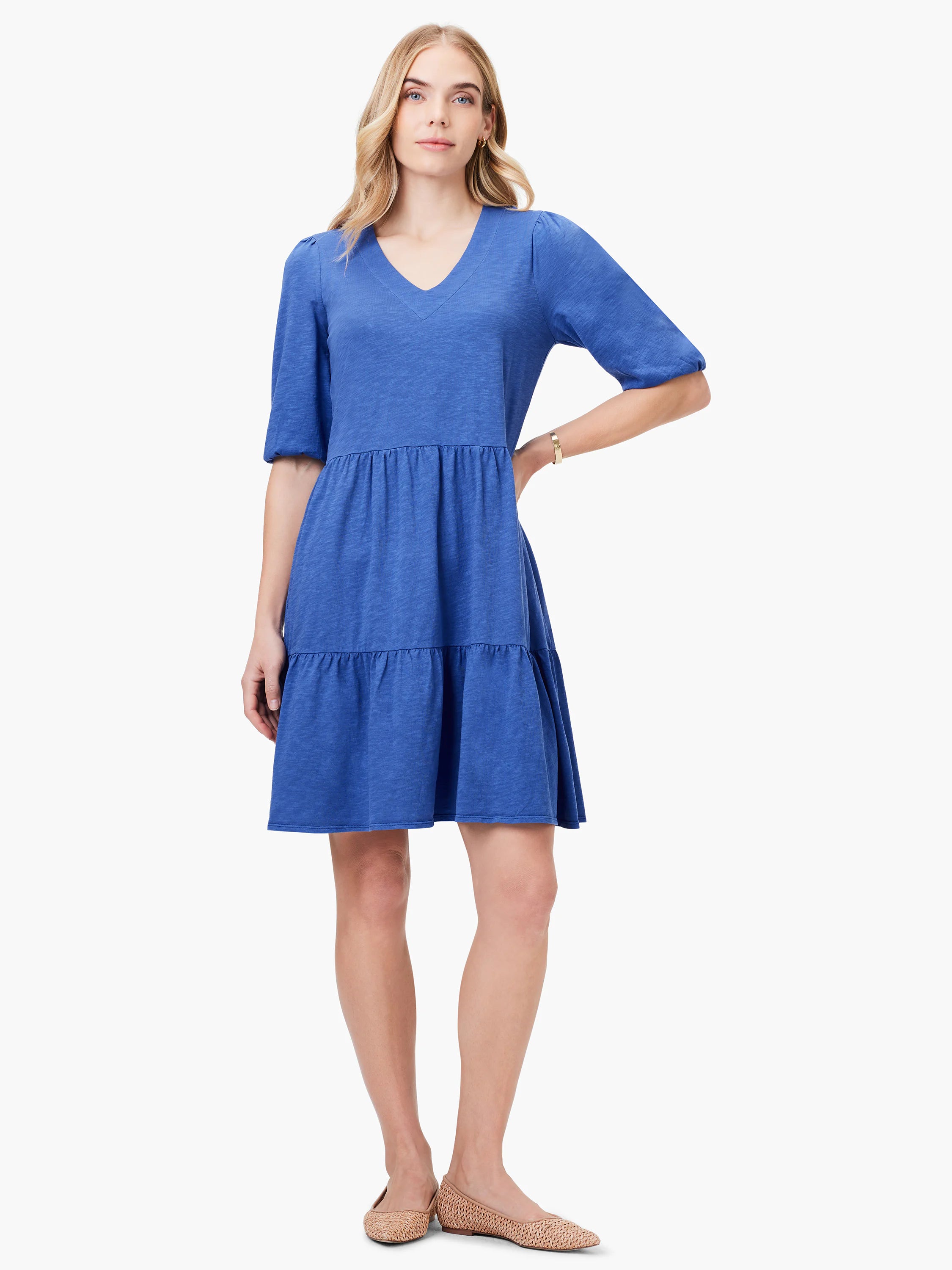 Blue tiered V-neck mini dress with short, puffed sleeves.