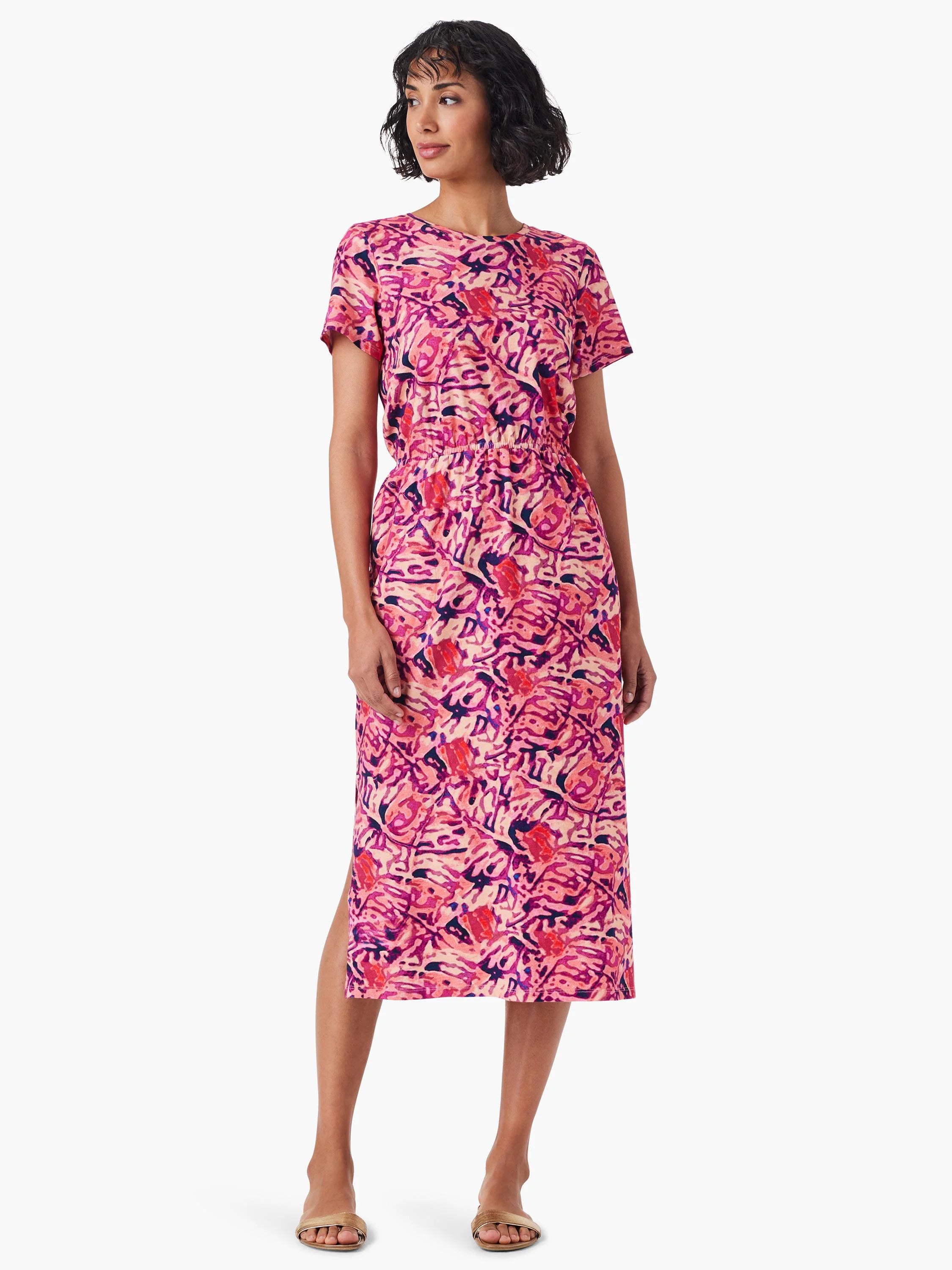 Pink midi dress with short sleeves, abstract pink, purple, and orange floral print, and side slit.