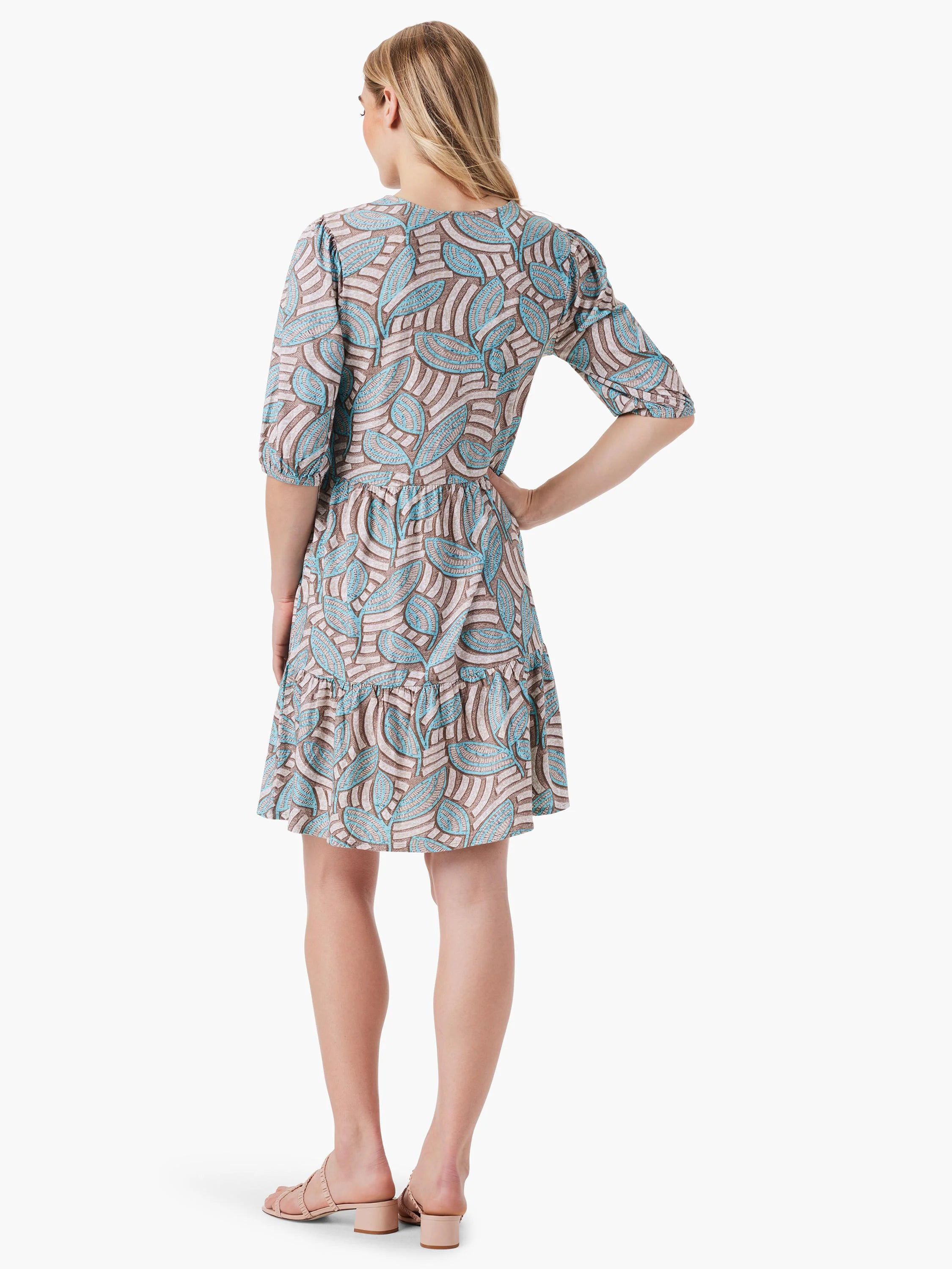 Teal and taupe leaf print mini dress, elbow-length sleeves, V-neck. Tiered skirt.