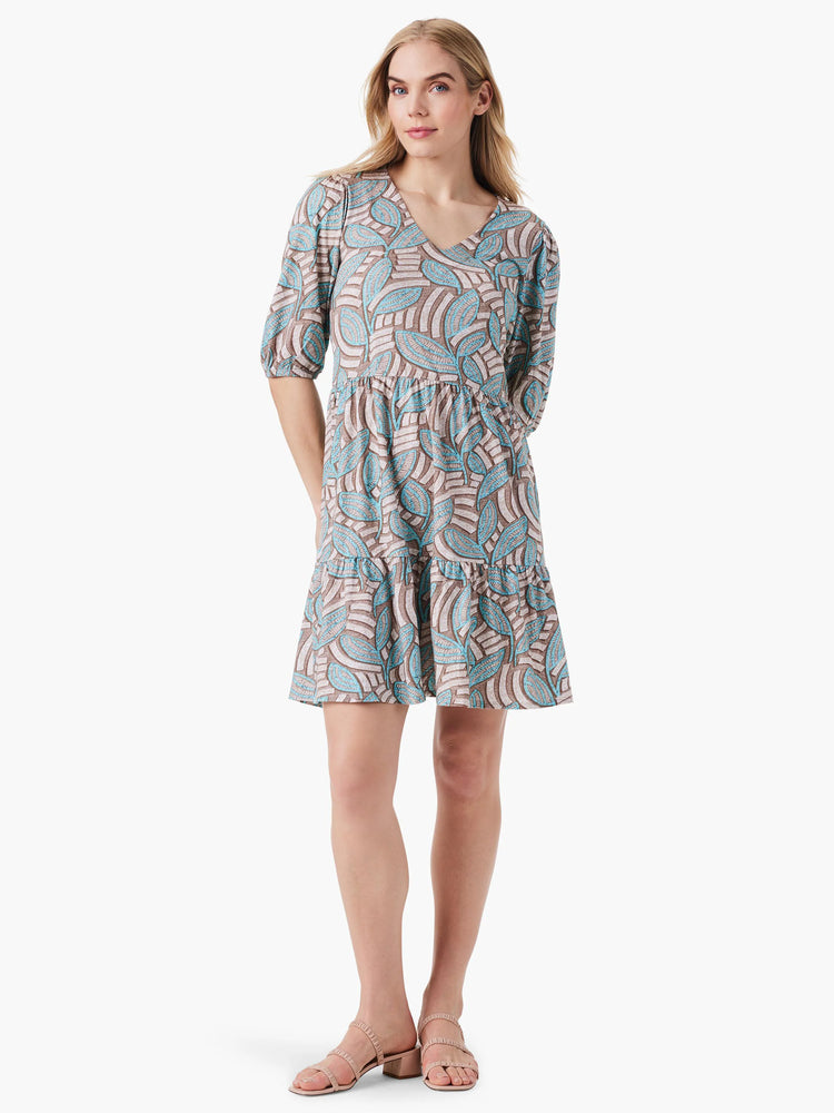 Teal and brown leaf patterned mini dress; V-neck, elbow sleeves, tiered skirt.