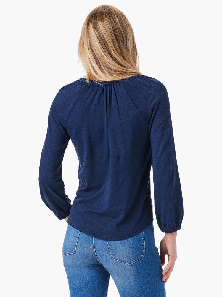 Here's alt text under 125 characters:
"Navy blue 3/4 sleeve top, split neck, raglan sleeves, slightly loose fit. Shown...