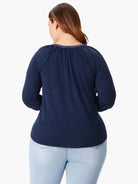 Dark navy blue, 3/4 sleeve top, split neckline, shown from the back.