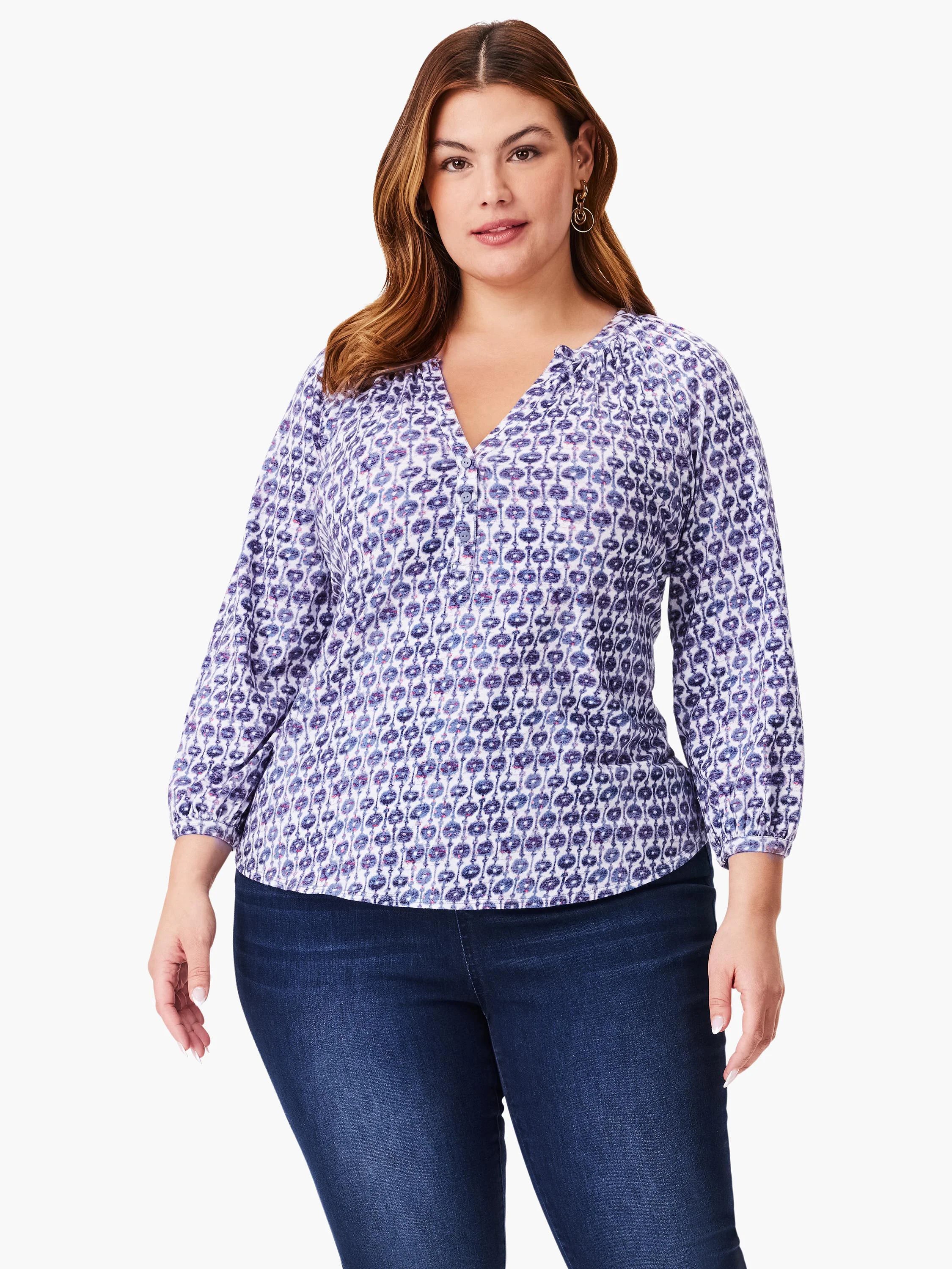 White top with 3/4 sleeves and a purple/blue medallion pattern. V-neck, button placket.