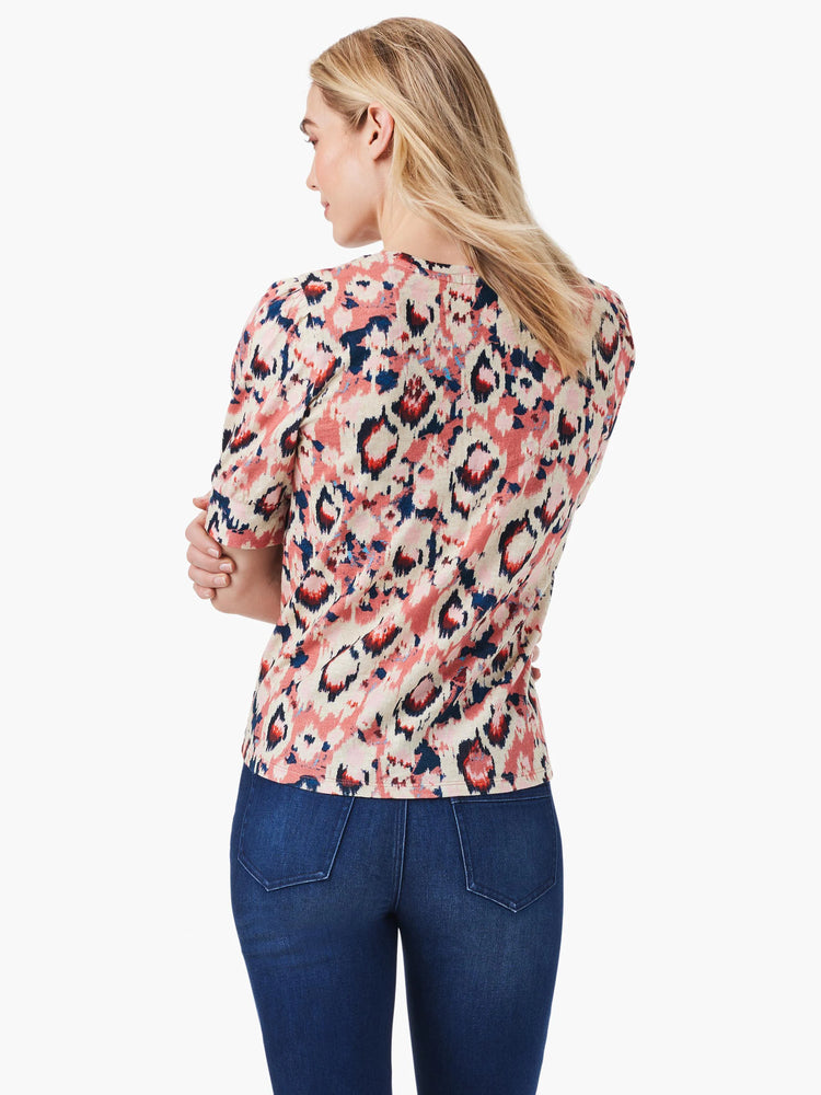 Scoop neck, short-sleeve top. Pink, beige, and navy ikat pattern. Elbow-length sleeves.