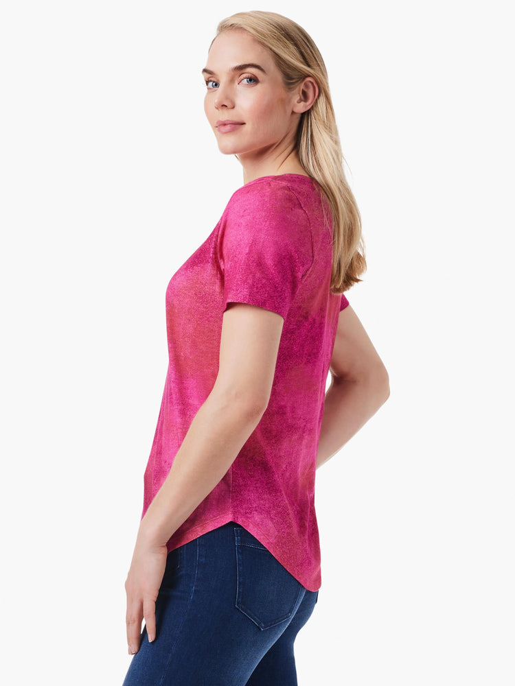 Pink short-sleeve V-neck tee, mottled texture. Darker pink and red tones throughout.
