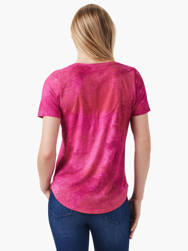 Pink short-sleeve V-neck tee. Back view shows a mottled, faded pink and reddish-pink pattern.