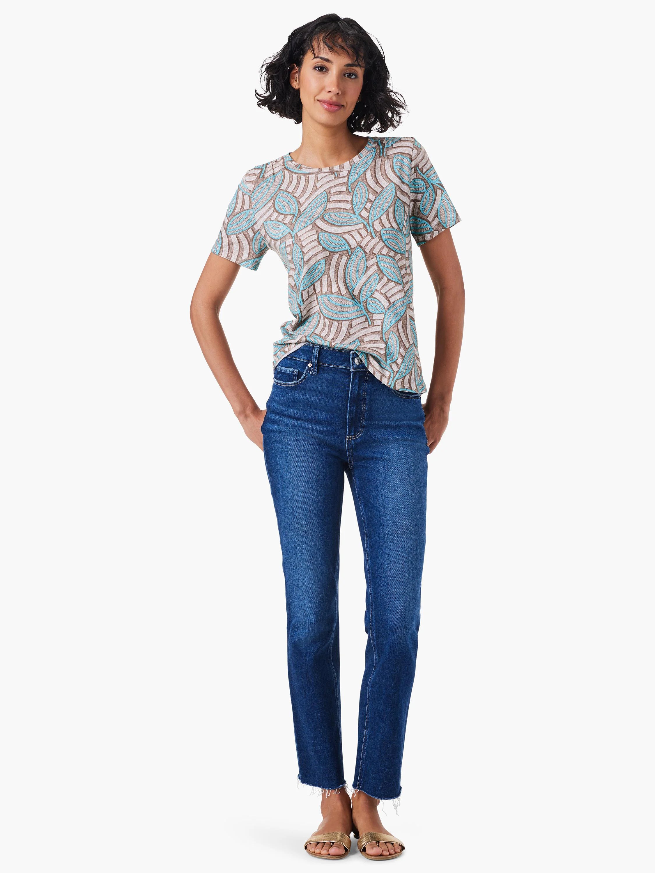 Short-sleeve crew neck tee with teal and brown leaf pattern on an off-white background.