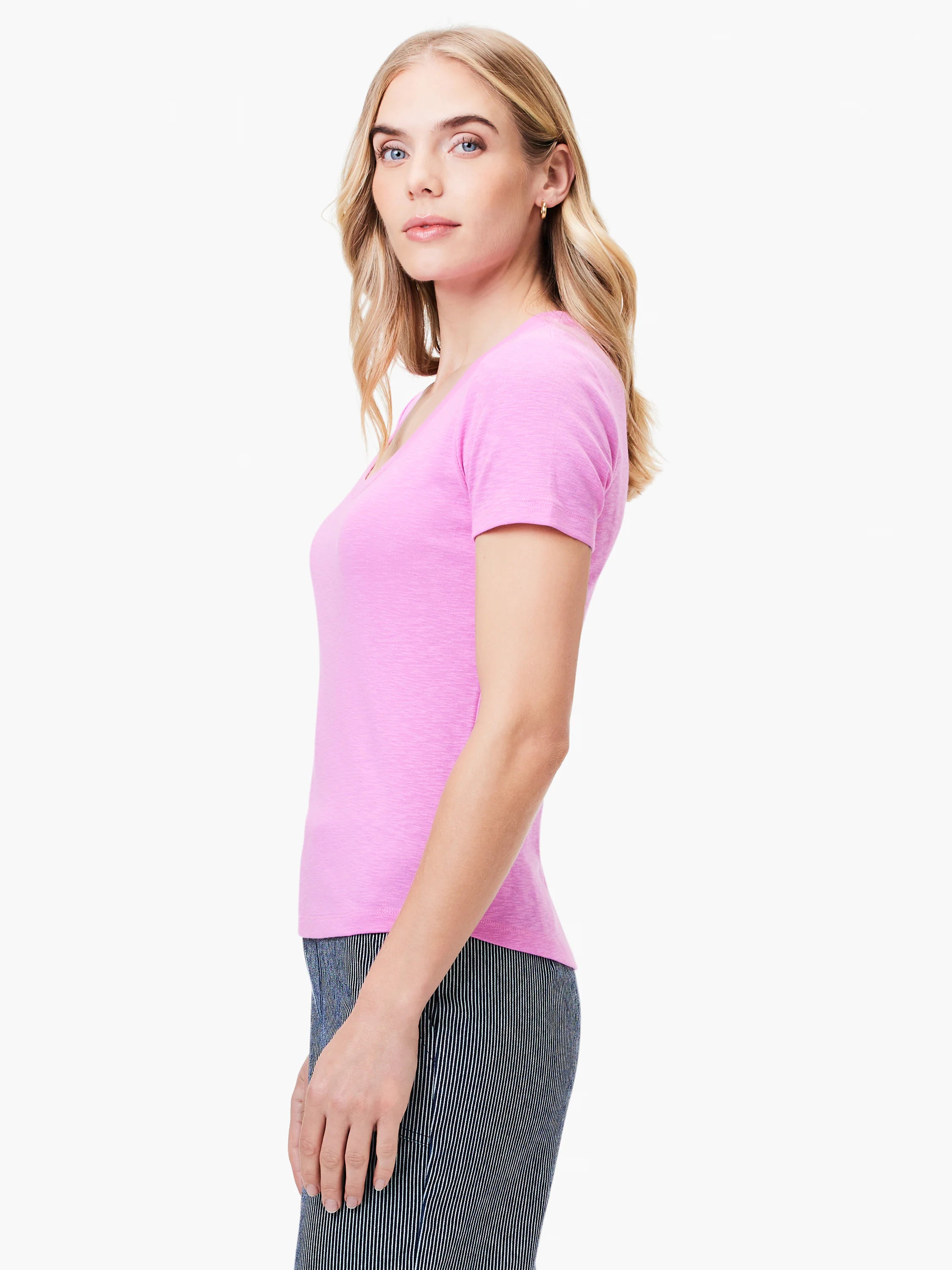 Pink scoop-neck tee with short sleeves. Side profile shows subtle texture.