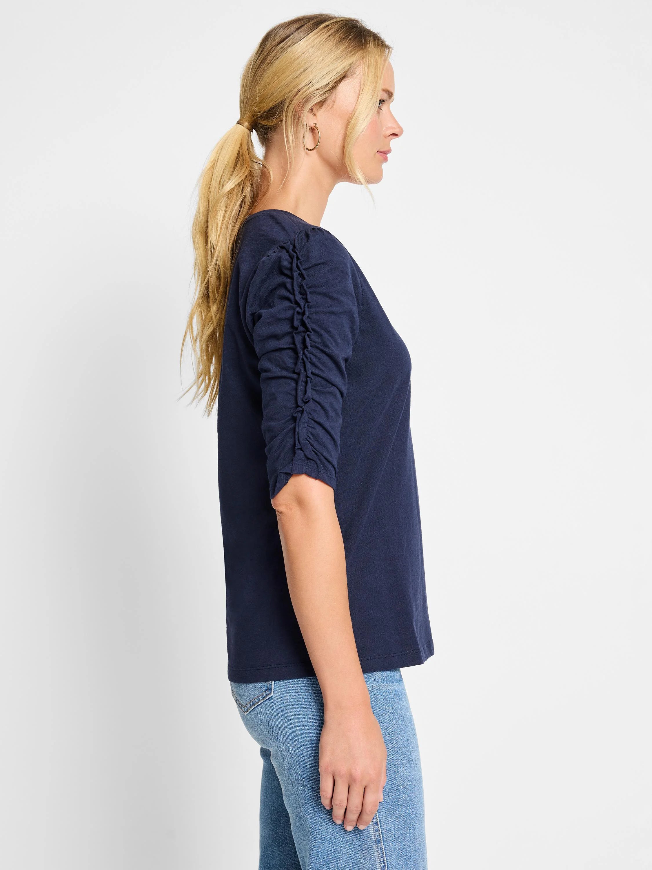 Dark navy blue, 3/4 sleeve t-shirt. Ruched detail on elbow-length sleeves. Split neckline.