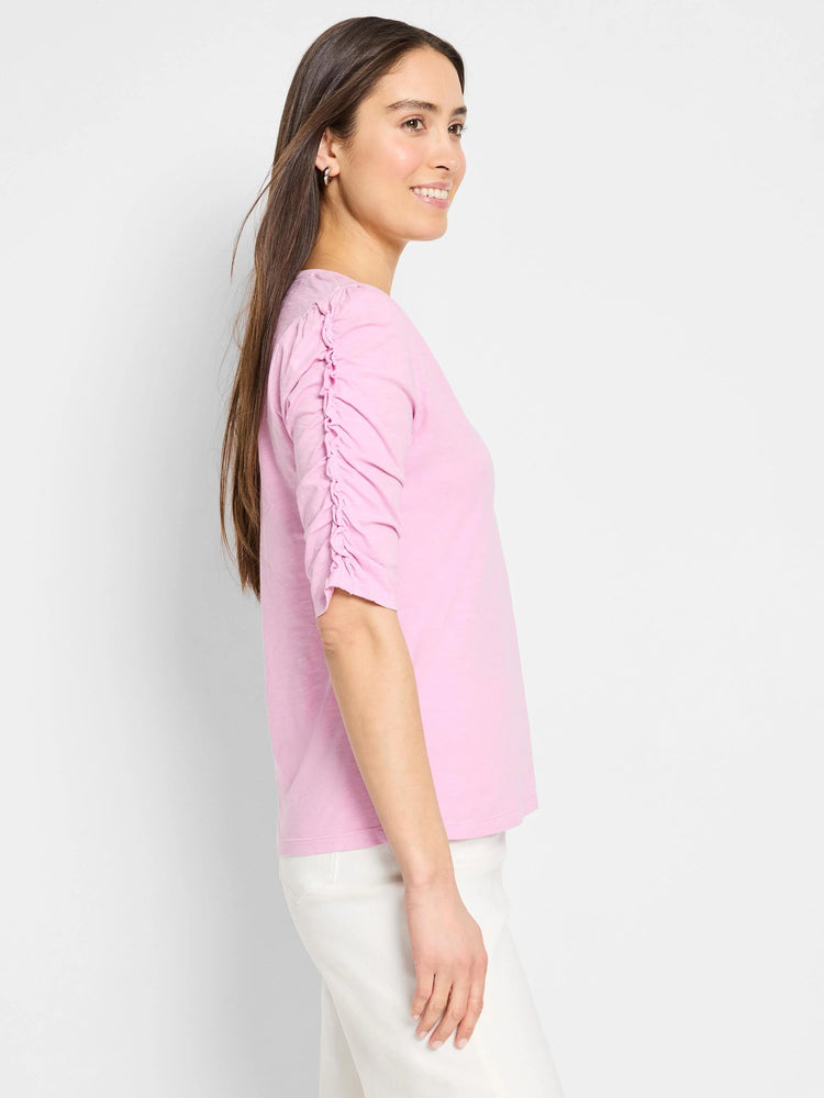 Pink, elbow-length sleeves with ruched detailing, split neckline, 3/4 sleeve.