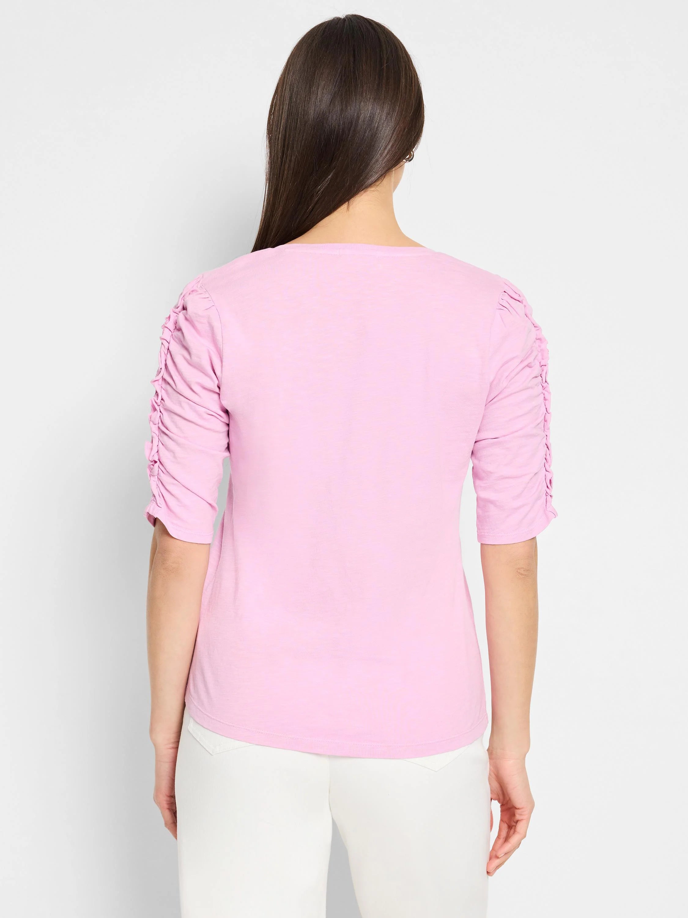 Pink, short-sleeved t-shirt. Ruched sleeves, split neckline. Shown from the back.