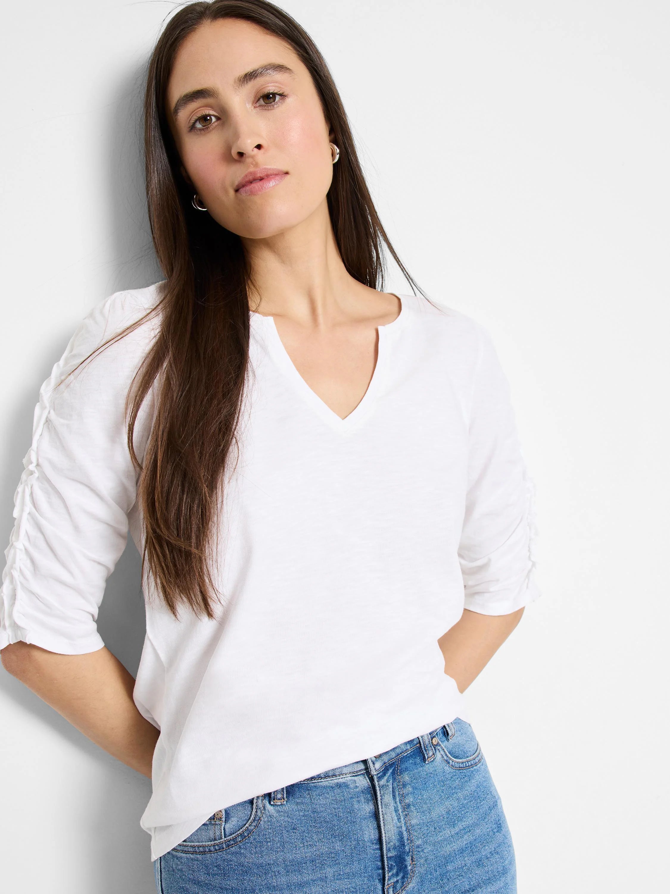 White, elbow-sleeve t-shirt. Split neckline, ruched sleeves.