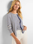 Cream and navy blue horizontally striped cardigan; snap front closure.  Three-quarter sleeves.