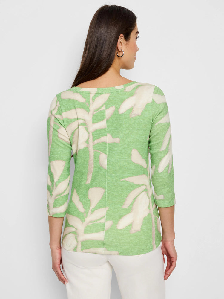 Here's alt text for the image, under 125 characters:
"Back view of light green 3/4 sleeve shirt. Features a fern-like...