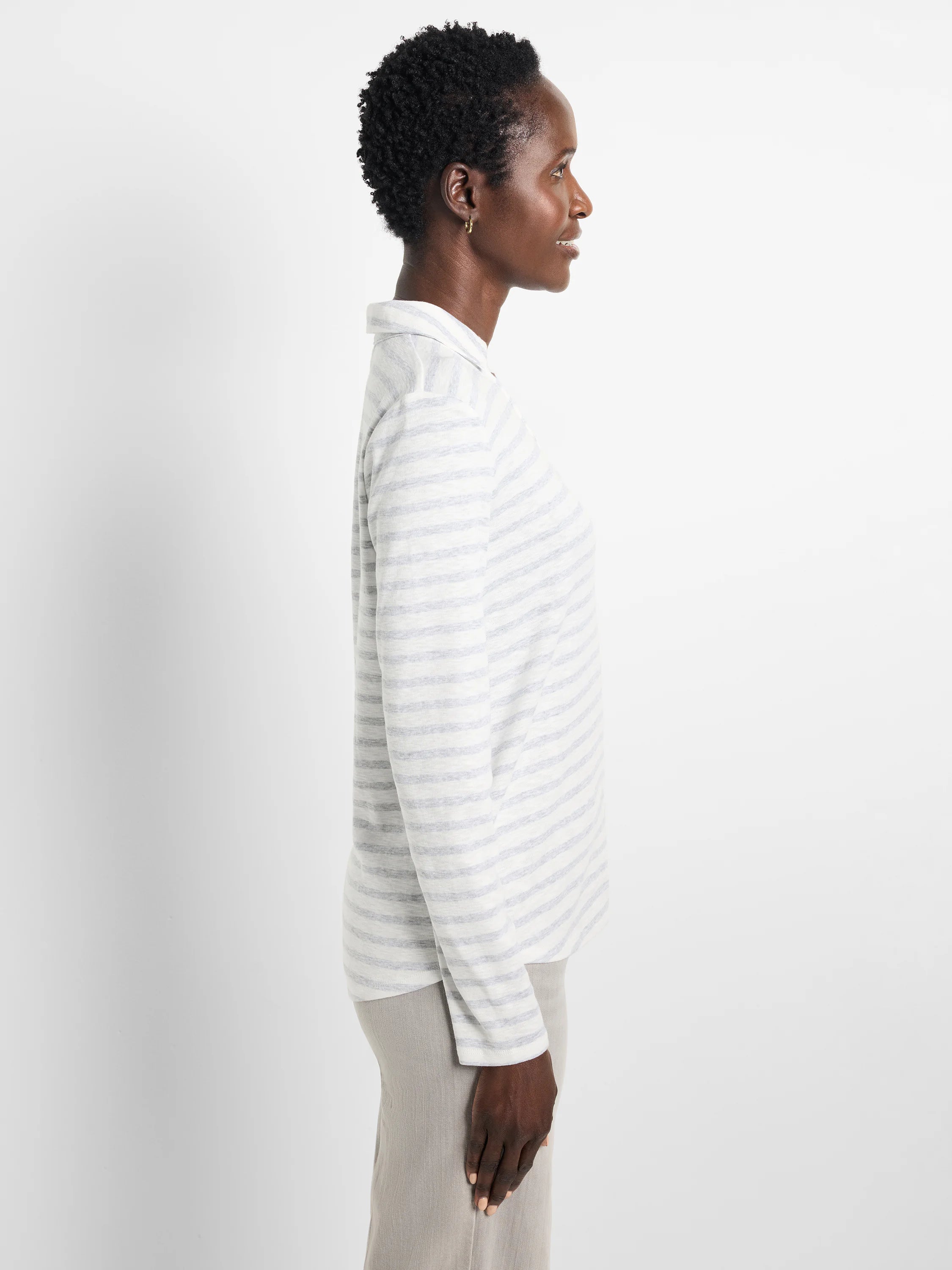 Off-white long-sleeve polo shirt with thin, light-blue horizontal stripes.  Easy fit.