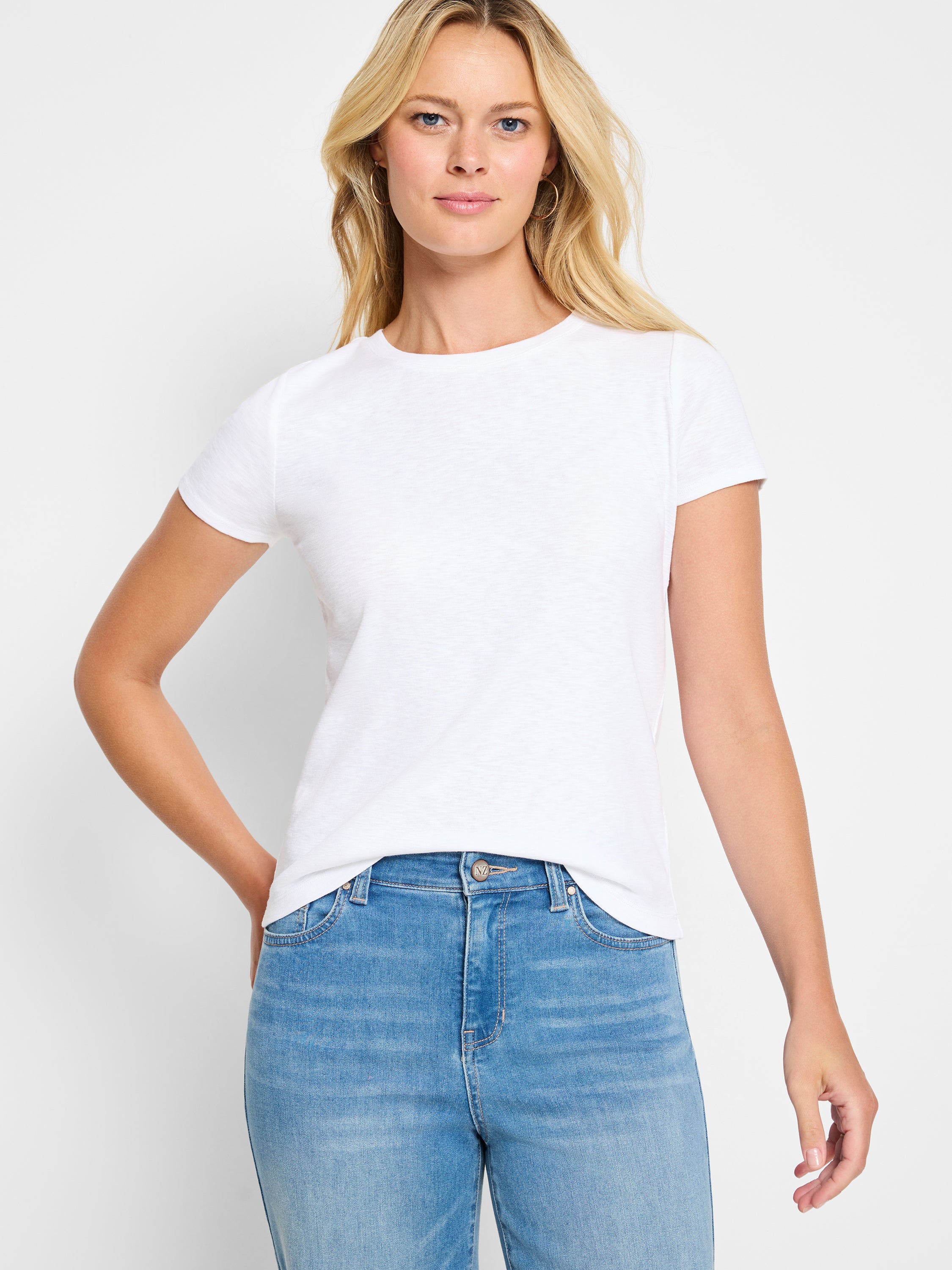 A relaxed fit white slub knit short sleeve t-shirt features a simple crewneck style.