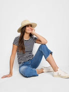 Navy blue and white striped short-sleeve shirt with a crew neck.