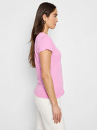 Pink lace-knit short-sleeved t-shirt with scalloped edges.