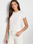 Off-white textured knit t-shirt.  Short sleeves with scalloped edges. Crew neck.