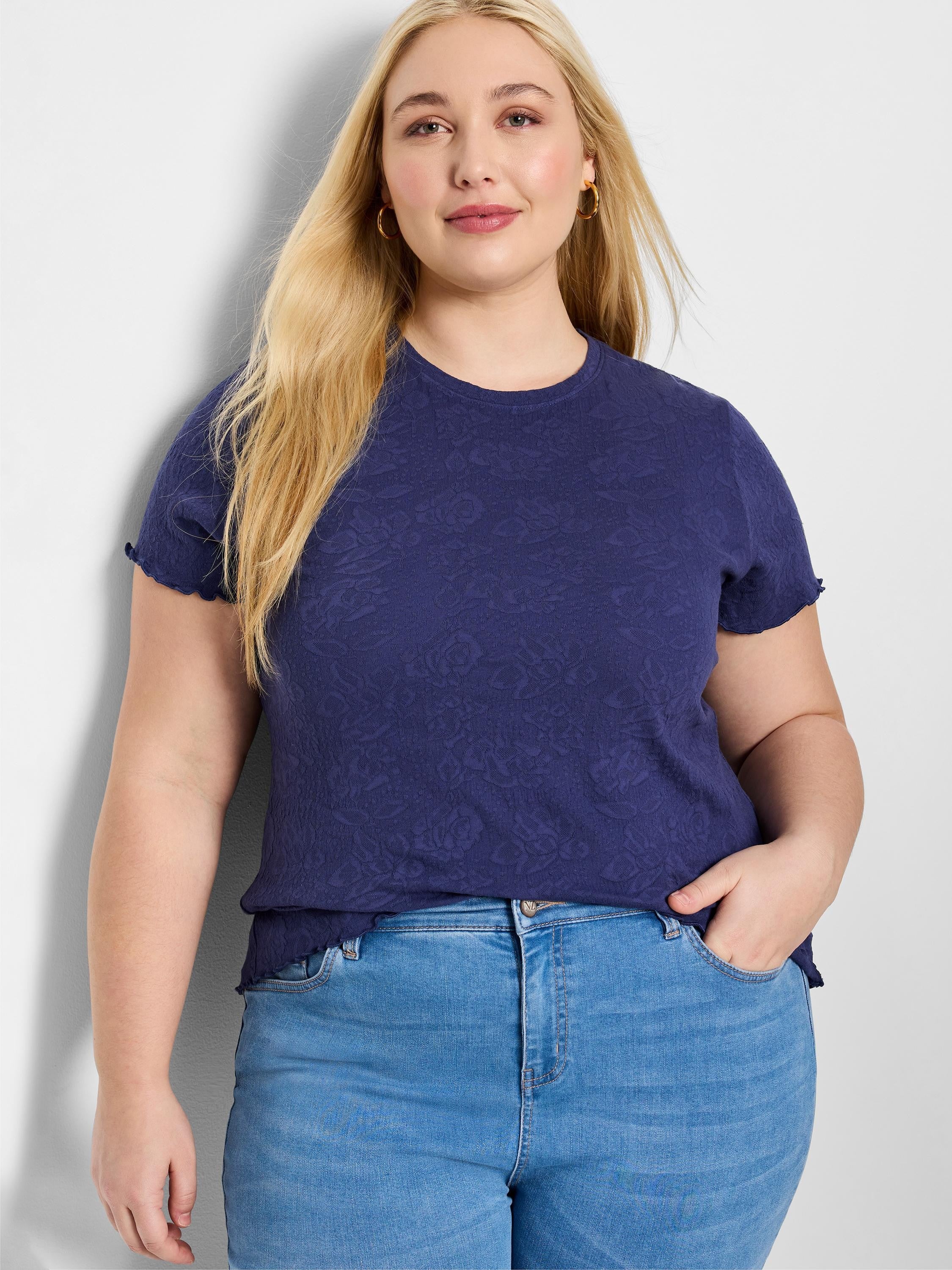 Navy blue lace-knit t-shirt with short sleeves and a textured floral pattern.