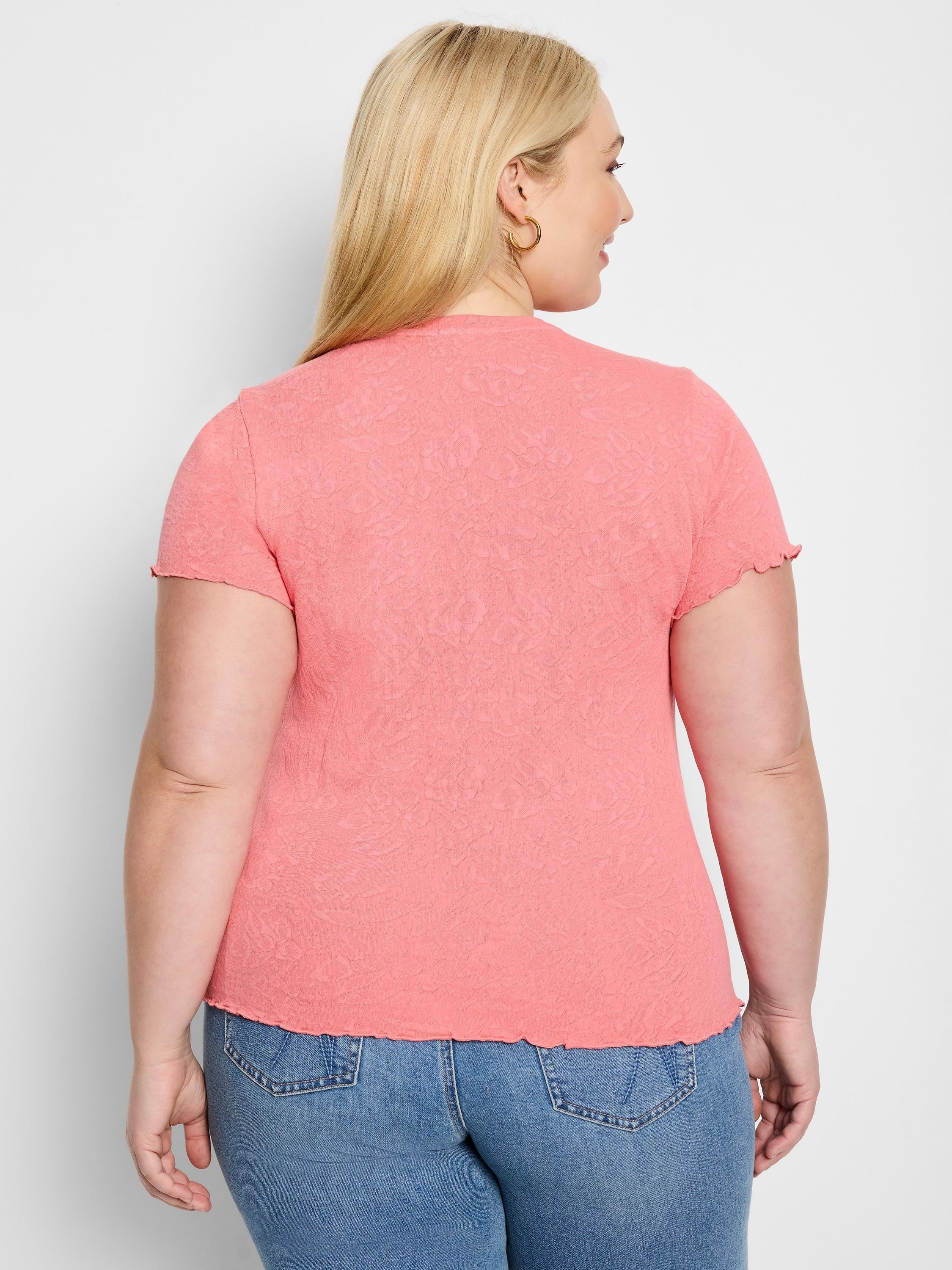 Coral pink, short-sleeve t-shirt with textured, lace-knit pattern and scalloped hem.