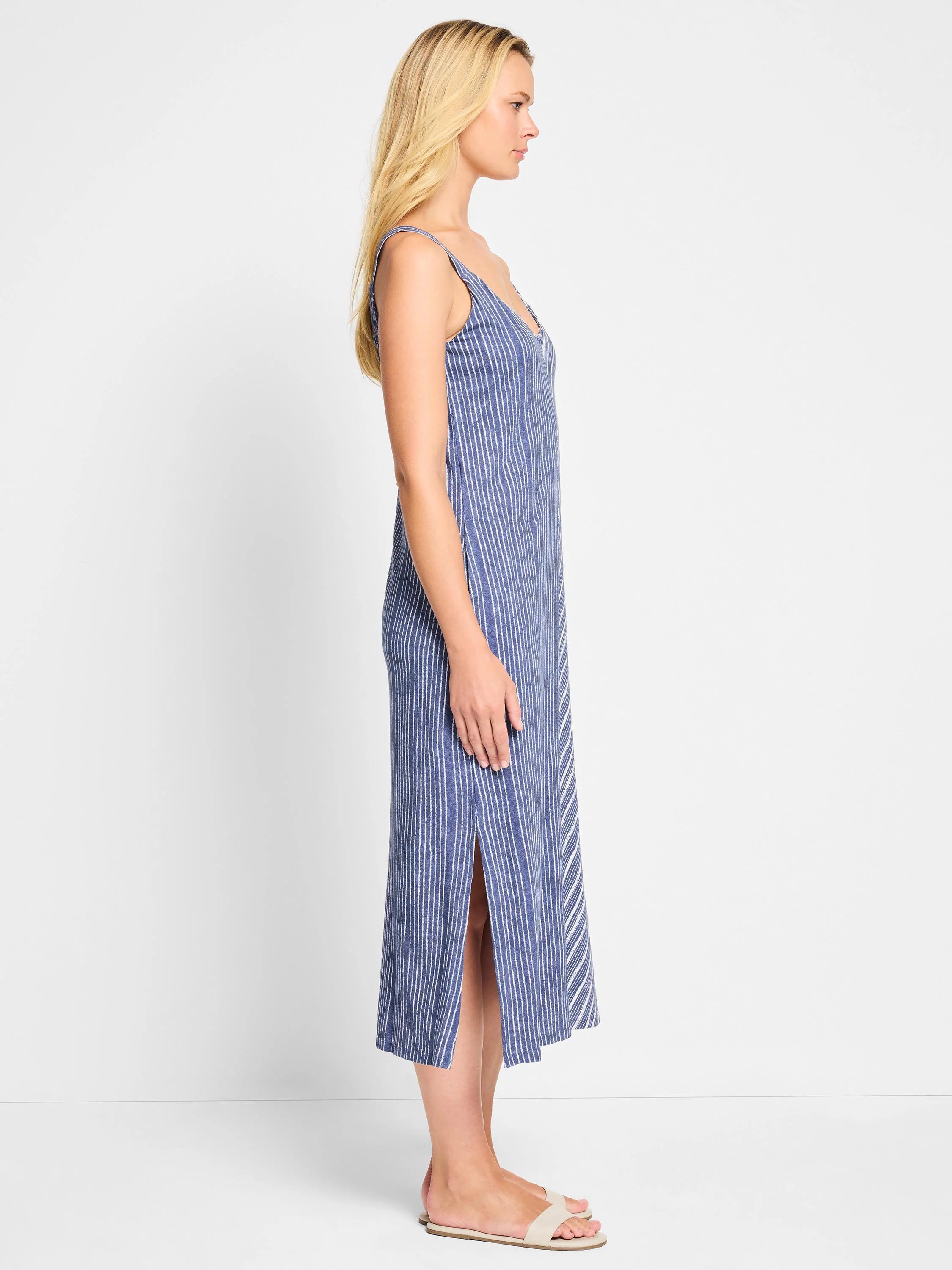 Midi-length V-neck tank dress; blue with thin white vertical stripes,  side slit.