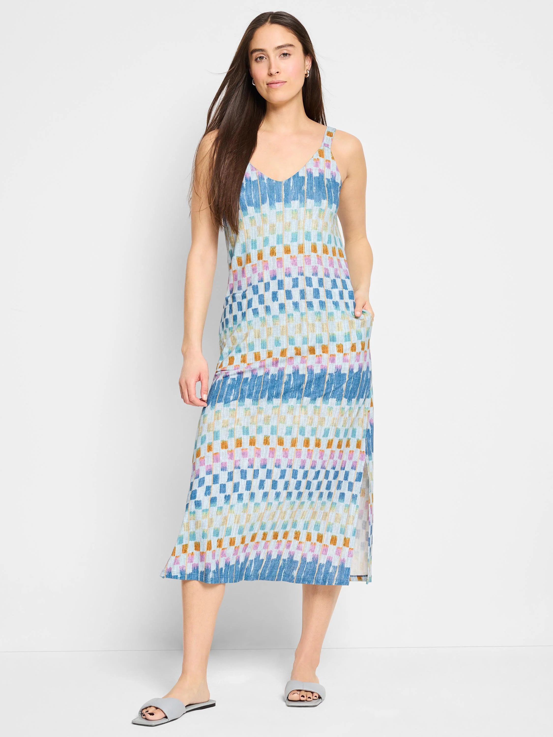 Mid-length sleeveless V-neck dress with side slits.  Blue, beige, orange, and pink checkered pattern.