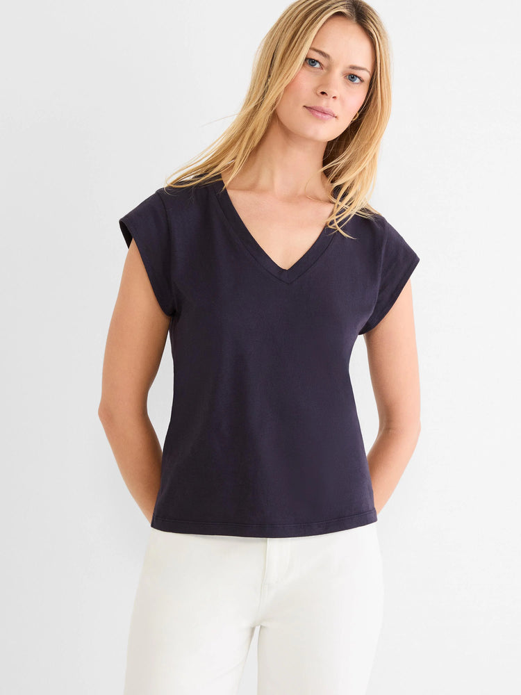 Navy V-neck tee with cap sleeves, modeled on a person.
