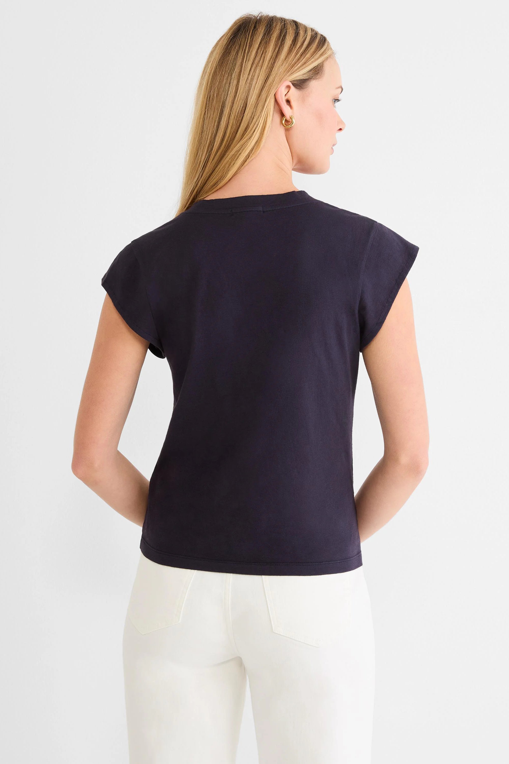 Navy cap sleeve tee, back view on model. Features a round neckline.