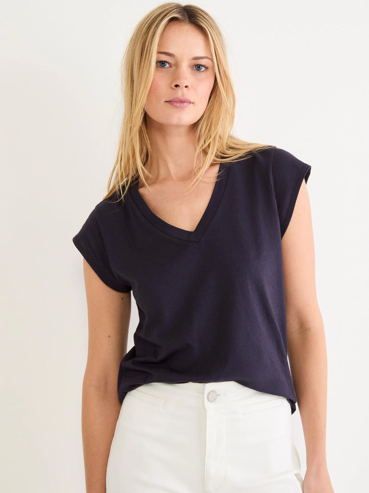 Dark navy V-neck tee with cap sleeves. Shows a relaxed fit on a model.