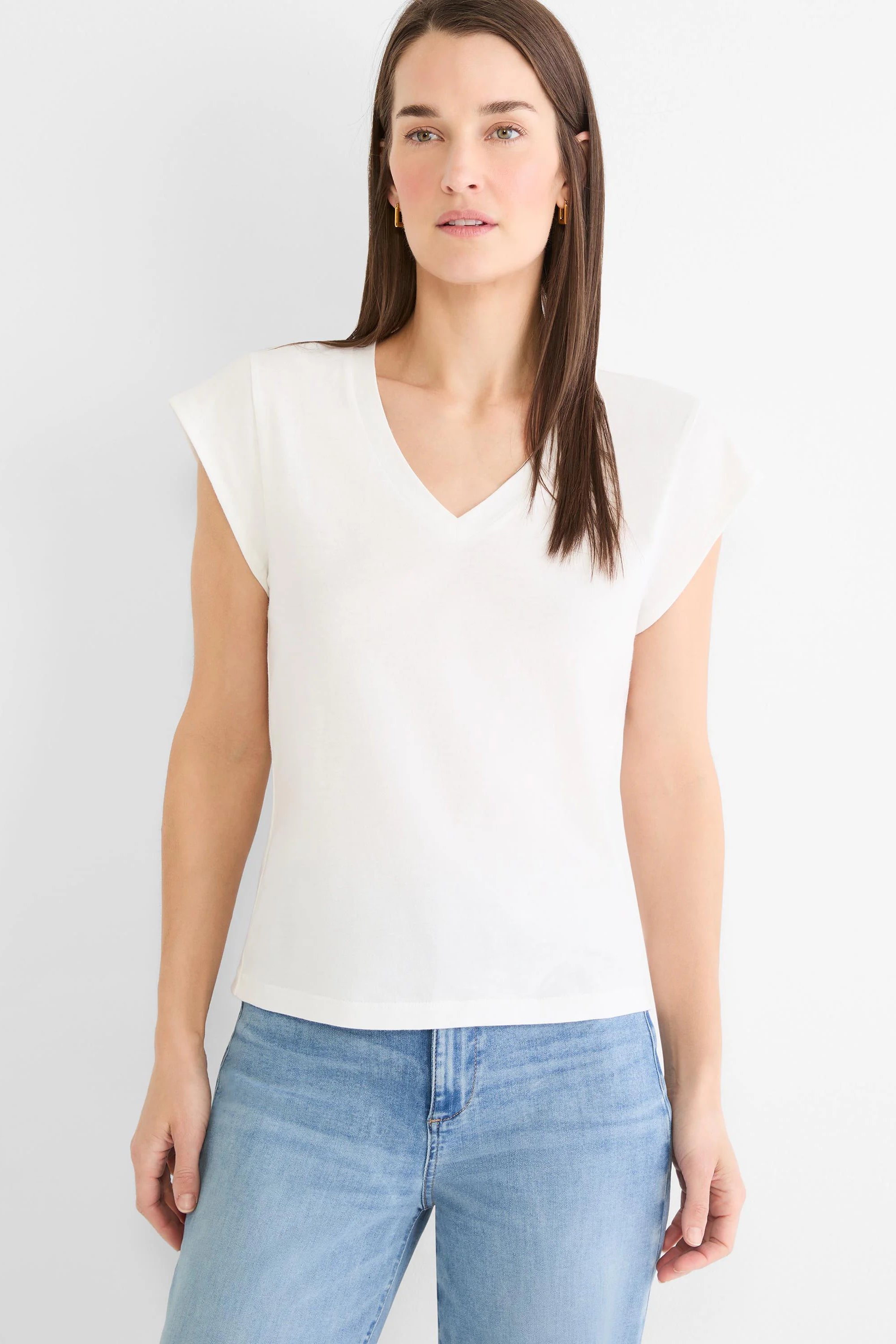 White cap sleeve V-neck tee, shown on model.