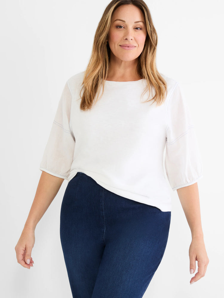 White cotton tee with sheer 3/4 length linen sleeves, gathered cuffs, and subtle blue seam stitching.