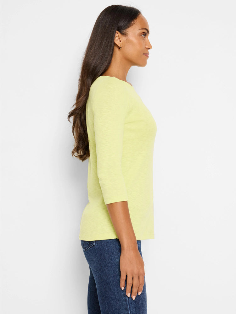 Pale yellow 3/4 sleeve boat neck tee with a textured fabric, worn by a woman shown from the side.