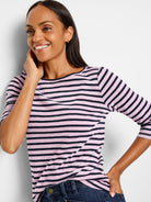 Light pink and navy horizontal striped 3/4 sleeve boat neck tee.
