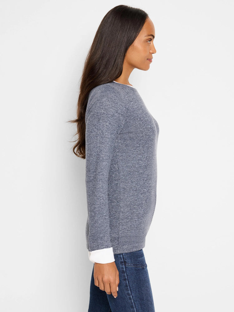Gray heather double-layered top with white cuffs. Long sleeves, round neckline.