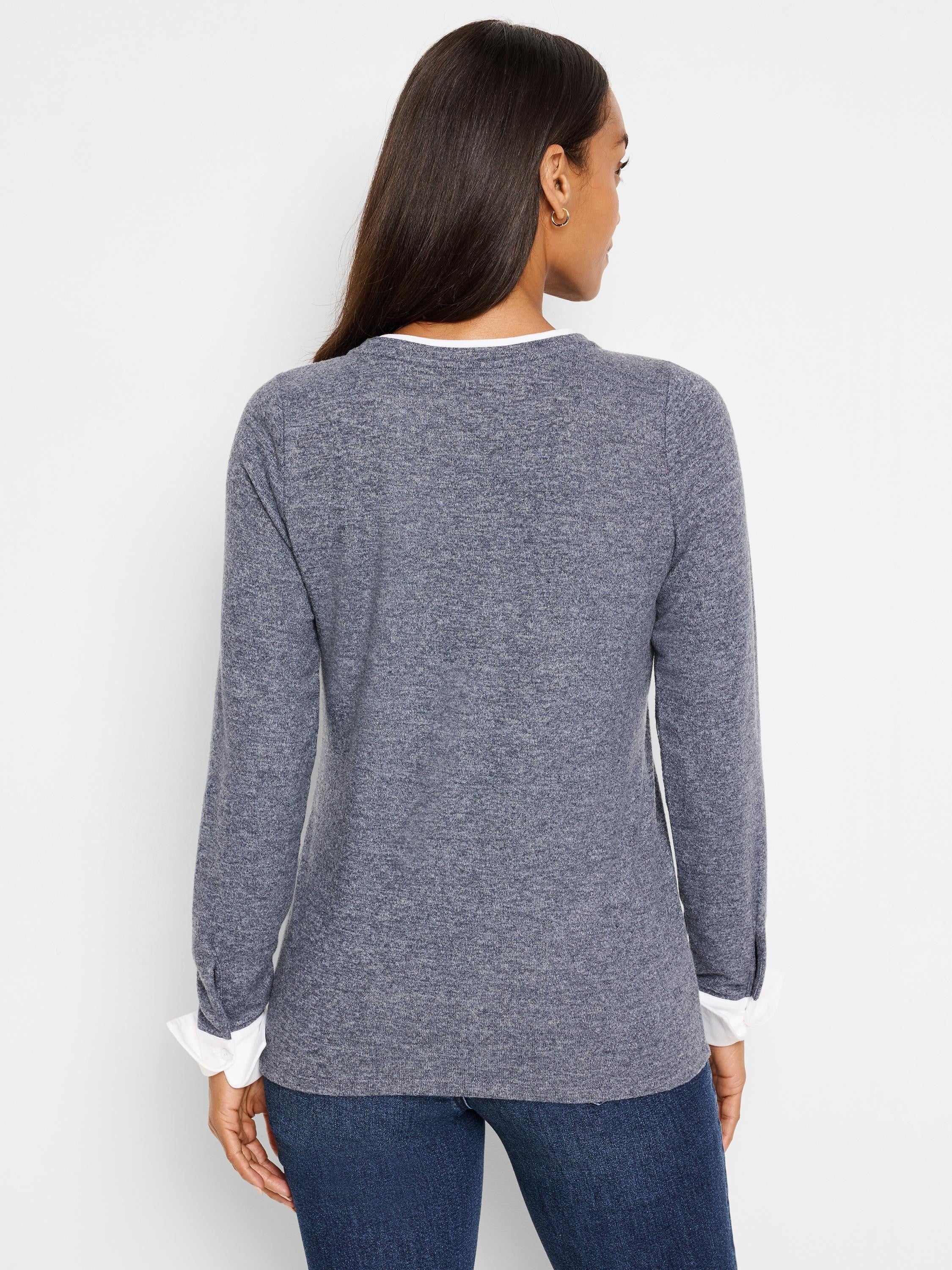 Here's alt text for the image, aiming for under 125 characters:
Gray double-layered top, white cuffs, long sleeves. ...