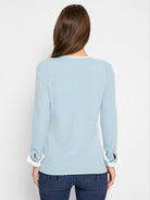 Here's alt text for the image, under 125 characters:
"Back view of a light blue, double-layered sweater with long...