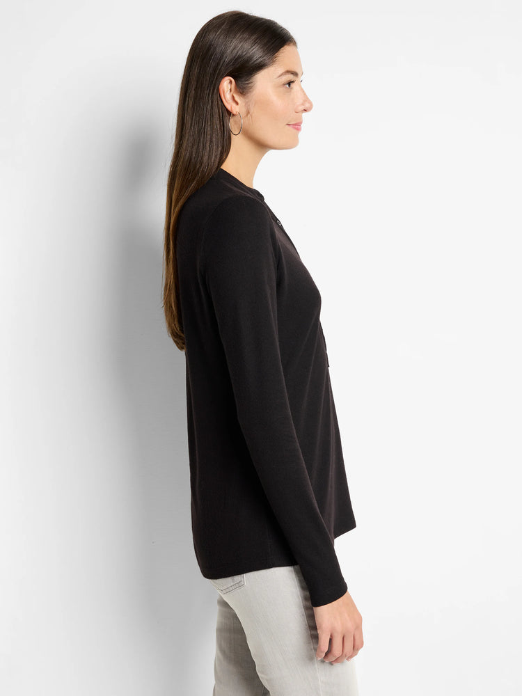 Black long-sleeve henley shirt; side profile. The shirt has a henley neckline and is shown on a model.