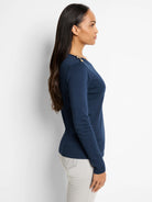 Navy blue long-sleeve shirt, off-the-shoulder neckline.  Gold buttons on one shoulder.