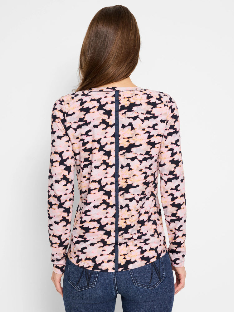 Pink and dark-navy abstract print long-sleeve crew neck tee. Back view shows a vertical navy seam detail.