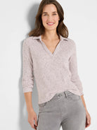 Heathered light pink ribbed long-sleeve polo with a collar and V-neck.